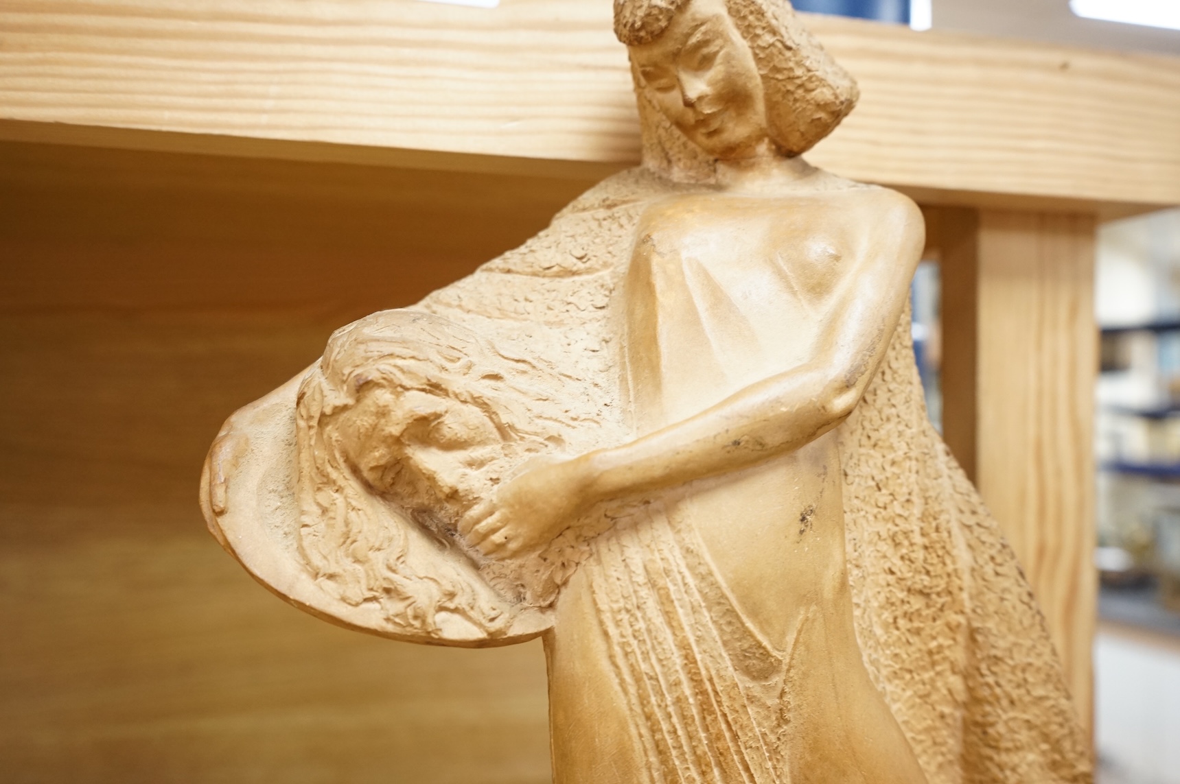 ZFW, a terracotta figure of a classical maiden, signed and dated ‘43, 36cm high